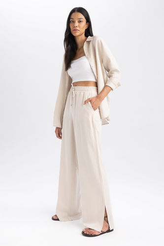 SANDRO High-Waisted Trousers With Wide Turn-Ups in Ecru | Endource