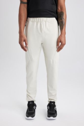 DeFactoFit Sporcu Jogger Eşofman Altı Slim Fit Dar Kesim Dokuma Üç Cepli Fermuarlı Paça