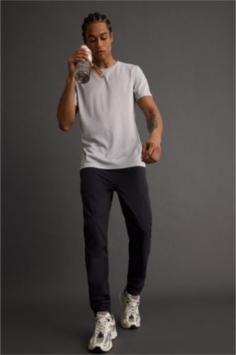 DeFactoFit Slim Fit Dar Kesim Çift Cepli Fermuarlı Paça Dokuma Jogger