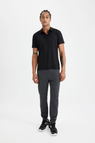 DeFactoFit Sporcu Dokuma Pantolon Slim Fit Dar Kesim Çift Cepli Fermuarlı Paça