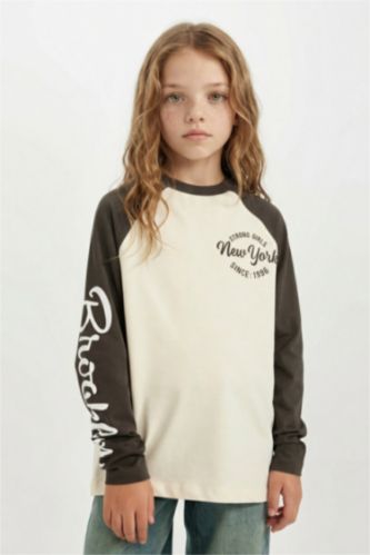 تيشيرت كم طويل واسع برقبة مستديرة