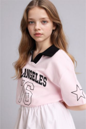 بنات زهري فاتح تيشيرت بولو بناتي اوفر سايز بطبعة شعار