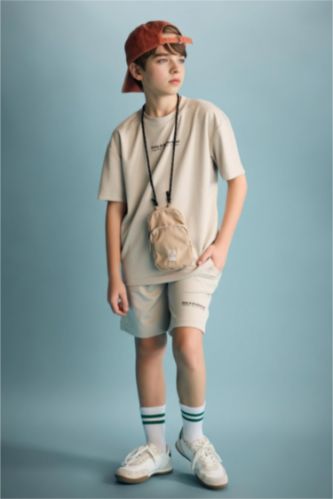 أولاد بيج شورت ولادي اوفر سايز بطبعة شعار