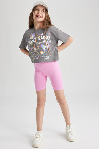 Full-length Side Portrait of the Young Athletic Woman in Black Short Top  and Gray Leggings Posing at White Background. Stock Photo - Image of  figure, leggings: 113618728