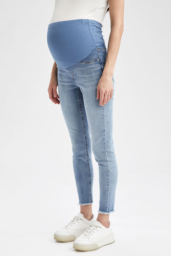 Pantalon de maternité en jean déchiré coupe skinny