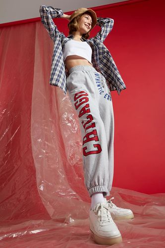 Спортивні штани-джоггери рілекс-фіт з принтом-написом