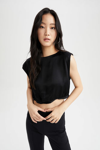 Тканна блузка з коротким рукавом чорного кольору
