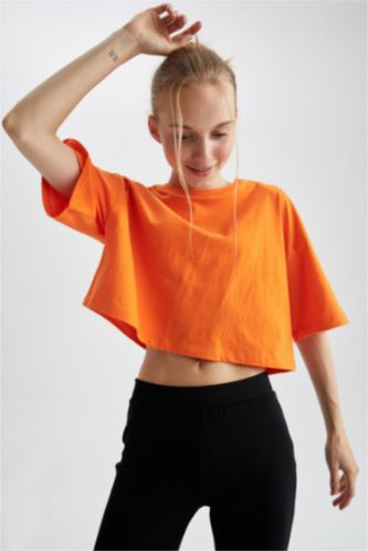 حريمي برتقالي تي شيرت قطن بأكمام قصيرة وقصة فضفاضة