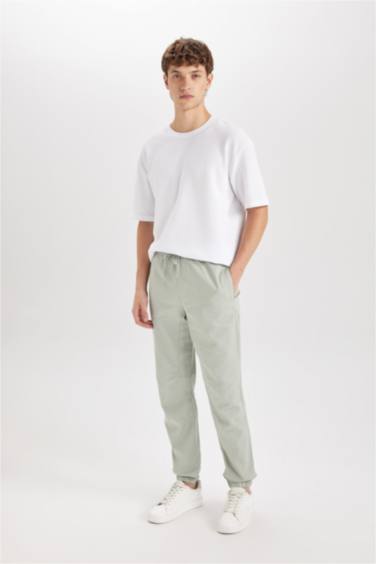 Габардиновые брюки стандартного кроя с гибкой резинкой на манжетах