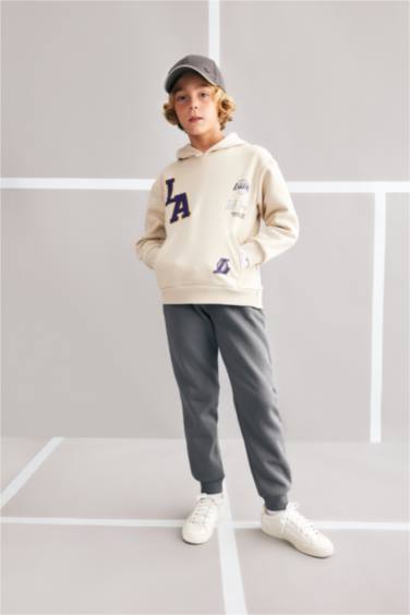 سويت شيرت اوفر سايز بكابيشون بجيب من لوس أنجلوس ليكرز