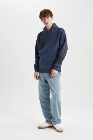 سويت شيرت اوفر سايز مطبوع بغطاء للرأس