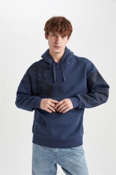 سويت شيرت اوفر سايز مطبوع بغطاء للرأس