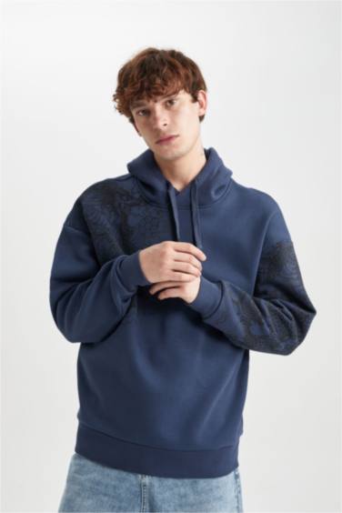 سويت شيرت اوفر سايز مطبوع بغطاء للرأس