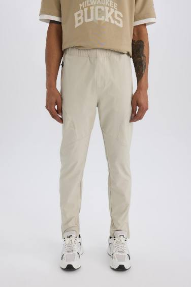 DeFactoFit Esnek Kumaş Sporcu Jogger Eşofman Altı Slim Fit Dar Kesim Dokuma Üç Cepli Fermuarlı Paça