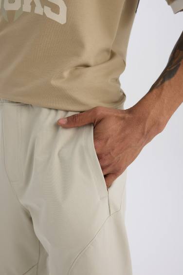 DeFactoFit Esnek Kumaş Sporcu Jogger Eşofman Altı Slim Fit Dar Kesim Dokuma Üç Cepli Fermuarlı Paça