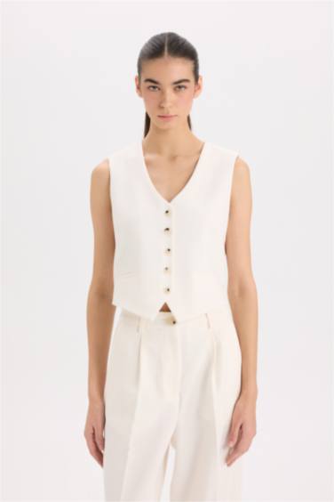 Жилет пиджак с V-образным вырезом и пуговицами