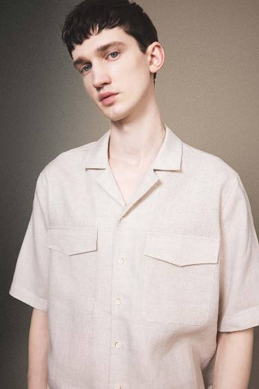 قميص بولو كتان بيج نص كم قصة مريحة