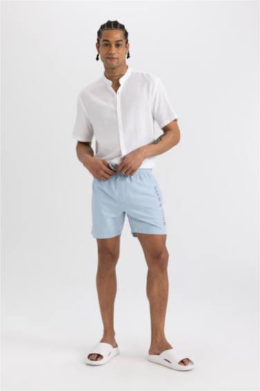 Short de bain avec doublure en filet