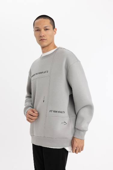 سويت شيرت مطبوع اوفر سايز برقبة مستديرة