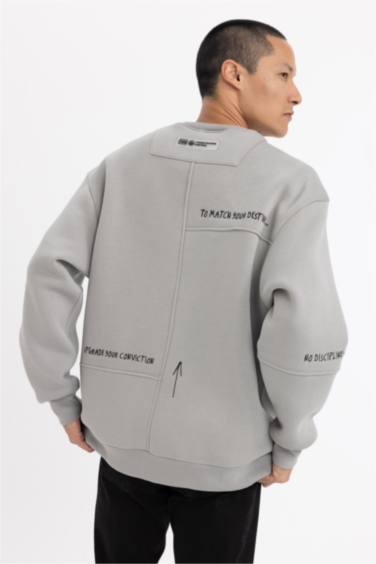 سويت شيرت مطبوع اوفر سايز برقبة مستديرة