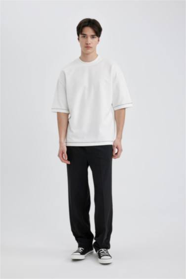 تيشيرت محبوك قصة فضفاضة بياخة مستديرة