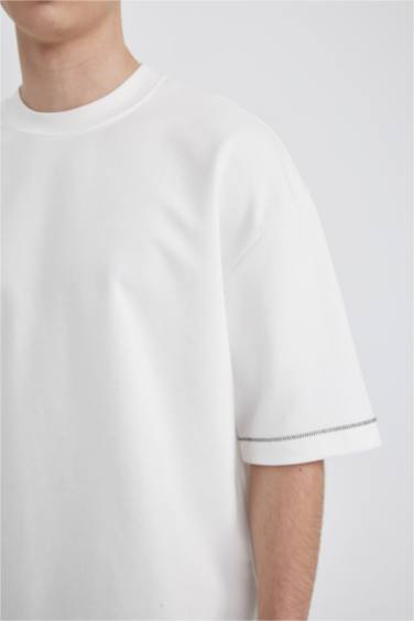 تيشيرت محبوك قصة فضفاضة بياخة مستديرة