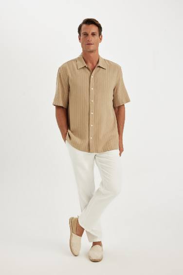 قميص بولو كتان مخطط قصة مريحة