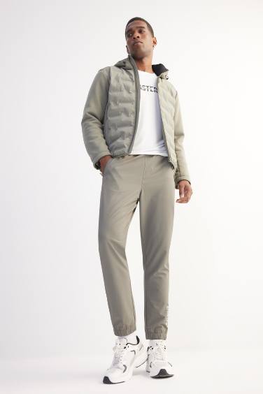 DeFactoFit Dokuma Esnek Multifonksiyonel Sporcu Jogger Eşofman Altı Slim Fit Dar Kesim Çift Cepli