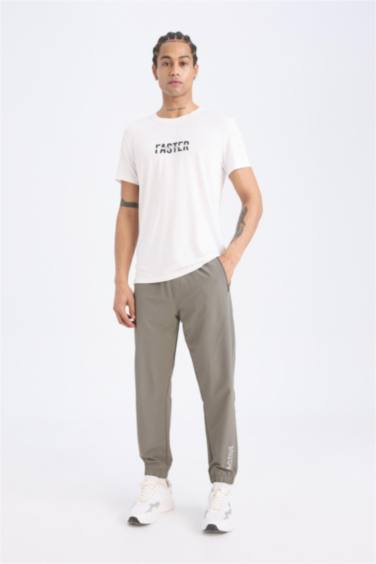 DeFactoFit Dokuma Esnek Multifonksiyonel Sporcu Jogger Eşofman Altı Slim Fit Dar Kesim Çift Cepli