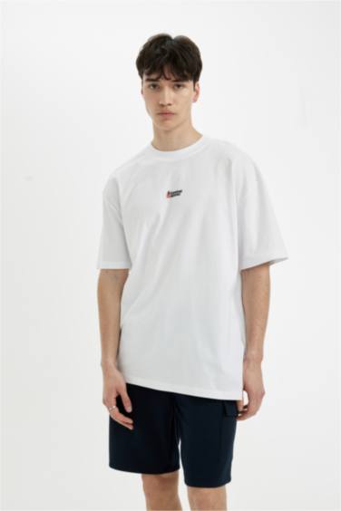 تيشيرت أوفر سايز نص ردن بياخة مستديرة بطبعة من الخلف