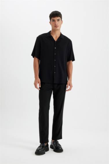 قميص بولو نص كم محبوك قصة مريحة