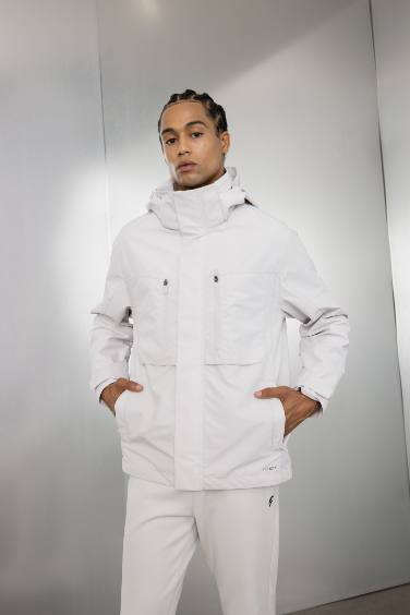 DeFactoFit Su İtici Kapüşonlu Rüzgar Geçirmez Dik Yaka Fermuarlı Cepli Yağmurluk Mont