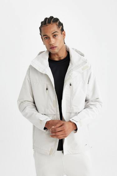 DeFactoFit Su İtici Kapüşonlu Rüzgar Geçirmez Dik Yaka Fermuarlı Cepli Yağmurluk Mont