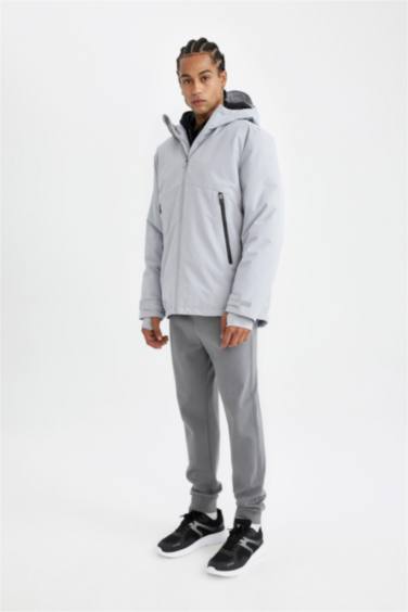 جاكيت قصة عادية بغطاء للرأس مقاوم للماء بسحاب من DeFactoFit