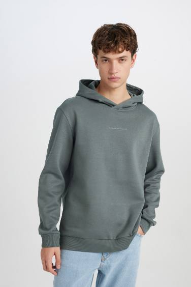 سويت شيرت مطبوع قصة عادية بكابيشون أخضر