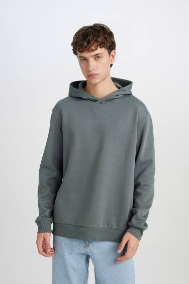 سويت شيرت مطبوع قصة عادية بكابيشون أخضر