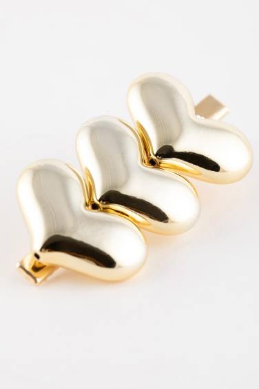 كلبس شعر حريمي ذهبي على شكل قلب