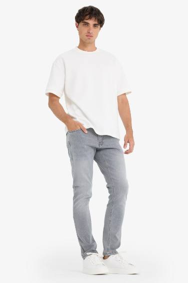 سروال جينز سليم للرجال بخصر عادي و جيوب