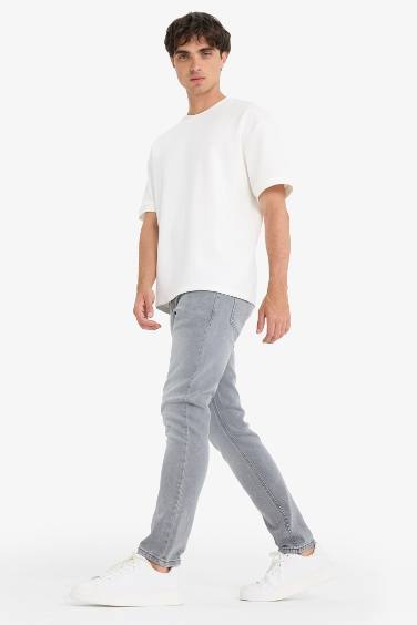 سروال جينز سليم للرجال بخصر عادي و جيوب