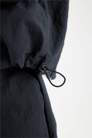 قميص اوفر سايز اولادي باراشوت كم طويل بسوسته