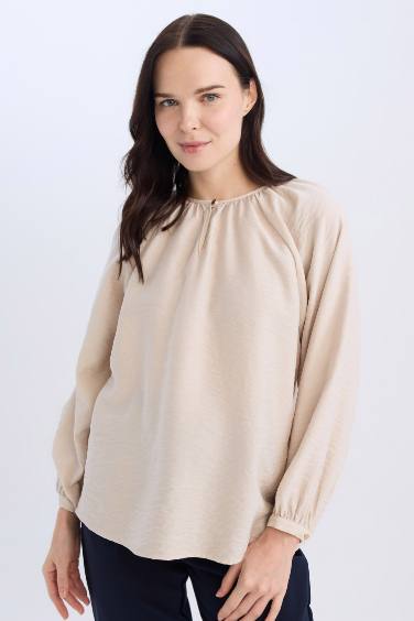 Blouse longue à col rond avec détails de boutons pour femme