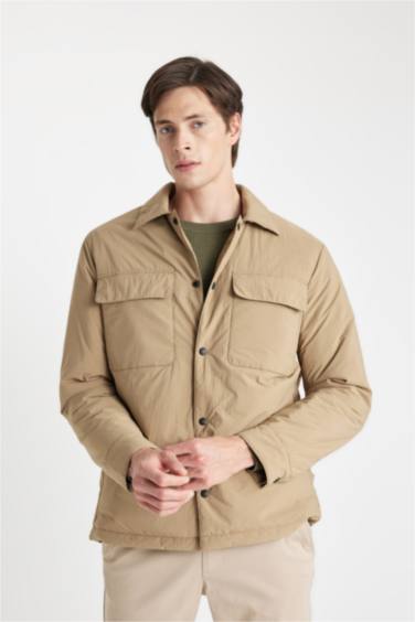 قمصلة نفخ سليم فيت بياقة قميص بجيب مقاوم للماء