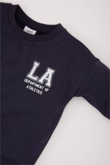 سويت شيرت بيبي اولادي كحلي بطبعة شعار قصة عادية وبطانة ناعمة