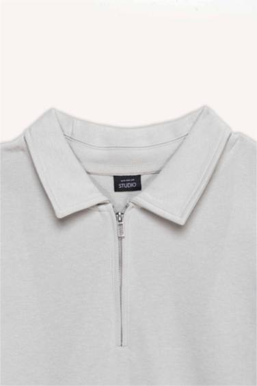 سويت شيرت قصة عادية بياقة بولو بسوسته