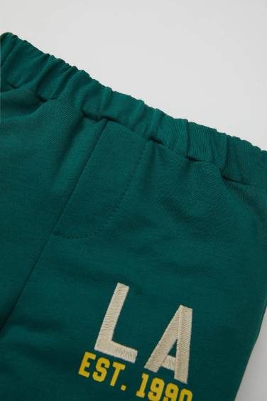 بنطلون سويت بانتس بيبي اولادي بطبعة شعار وقصة عادية أخضر غامق