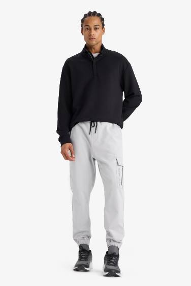 DeFactoFit Sporcu Jogger Eşofman Altı Standart Fit Üç Cepli Beli Bağcıklı Lastikli Paça