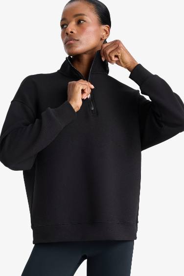 سويت شيرت رياضي اوفر سايز بياقة عالية من DeFactoFit