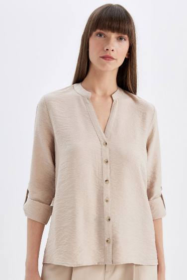 Chemise basique à manches longues avec détail de manche pliée, boutonnée