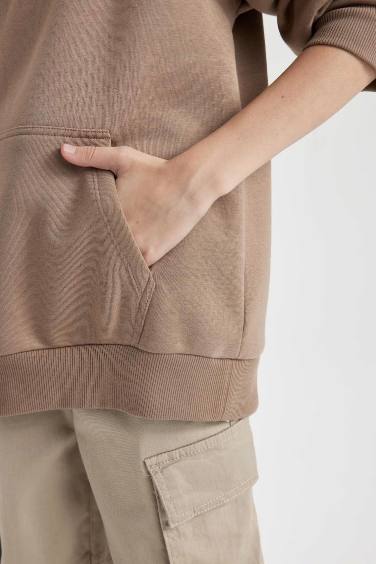 سويت شيرت اولادي اوفر سايز بجيب وطبعة من الخلف