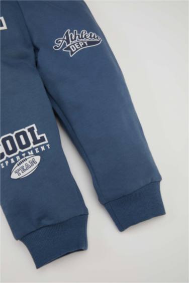 بنطلون سويت بانتس بيبي اولادي بطبعة شعار وقصة عادية نيلي فاتح